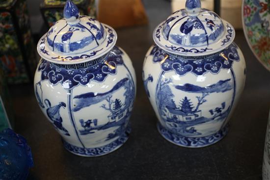 A pair of Chinese blue and white baluster jars and covers, late 19th century 28.5cm, both repaired